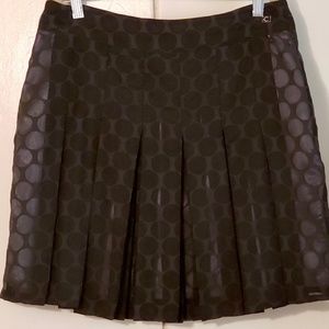 Castro black polkadot, pleated miniskirt size 4